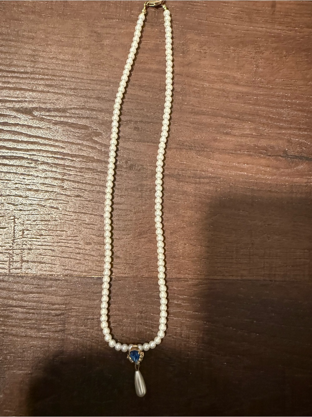 Classic White Pearl Necklace with Blue Accent and Teardrop Charm